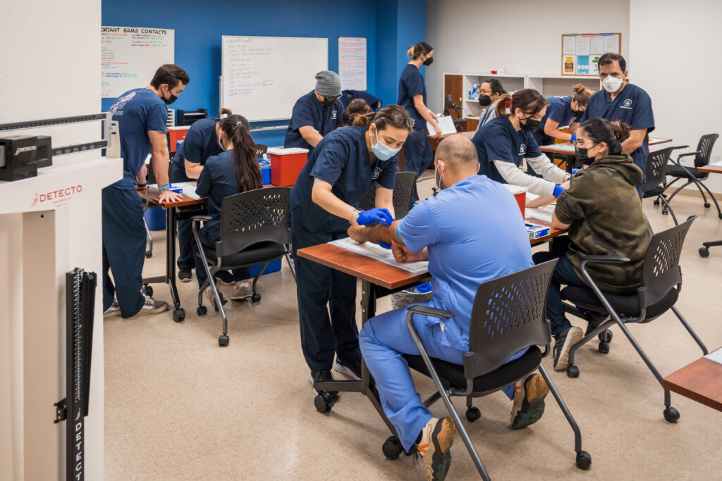 An adult healthcare student in a clinical classroom