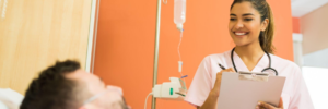 : A patient care technician taking a patient’s vitals.