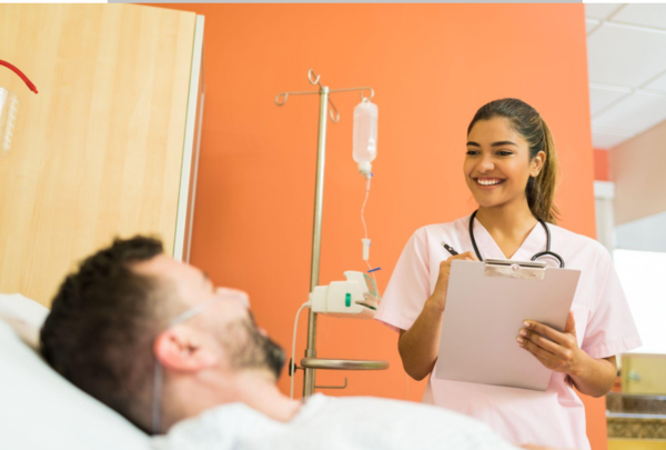 : A patient care technician taking a patient’s vitals.